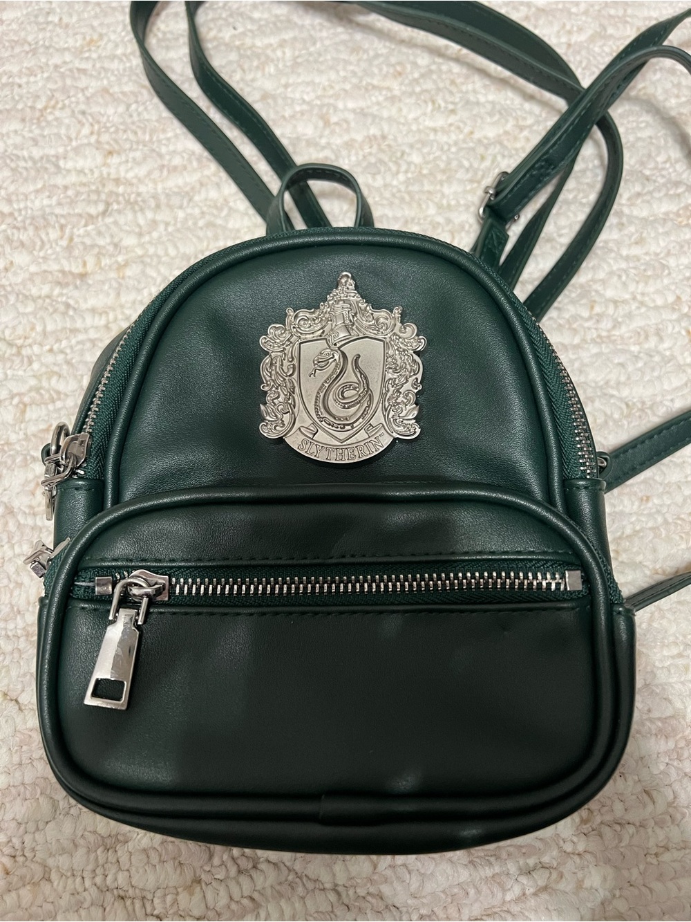 Dark Green Mini Backpack with Silver Crest Detail